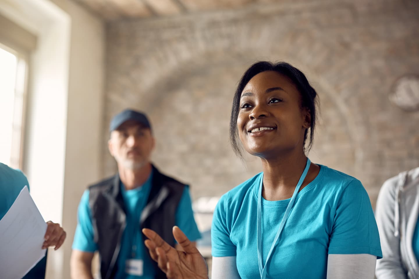 Smiling volunteer in a group discussion