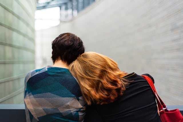 Two people share a comforting embrace.